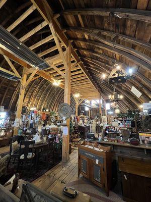 Hoop barn interior with added post and beam to keep it up for a while longer