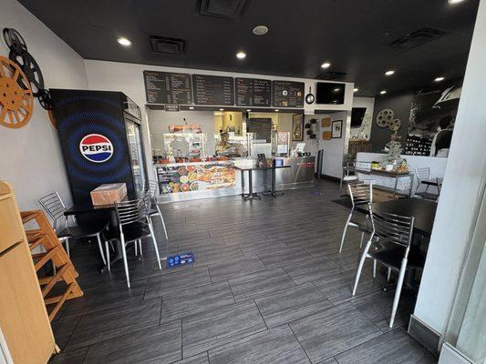 Restaurant interior, service counter, and tables