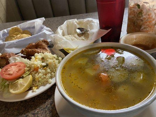 Sopa de Gallina. Crispy fried chicken soup. Fried chicken (on the bone) served on a platter with salad