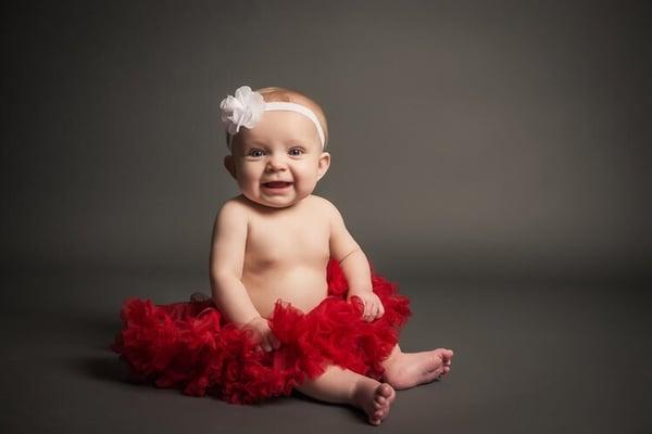 Adorable baby photos taken here! 6 months is the perfect age to have these babies photographed just as they are sitting up on their own!