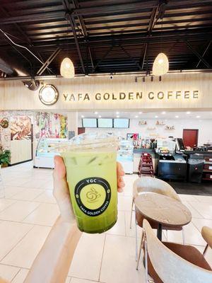 Golden matcha latte with ice and almond milk