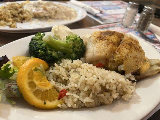 Crab stuffed rockfish with imperial sauce, rice pilaf, and broccoli