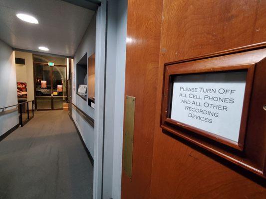 Sign on door of auditorium