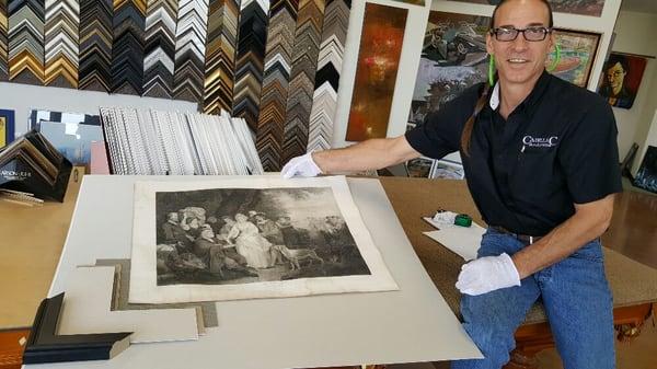 Jim is Custom Framing an art piece from 1792 that was saved from a fire in a museum.