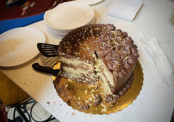 Yummy  cake with chocolate frosting and filling, and yellow cake.