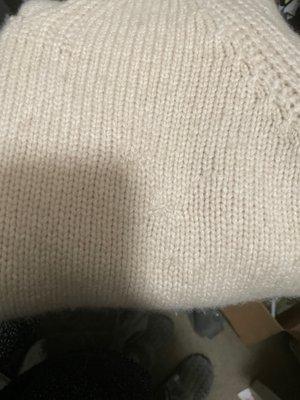 Cashmere sweater showing repair Work of moth holes...hardly noticeable!!