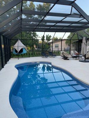 Pool area built by spa pool and patio