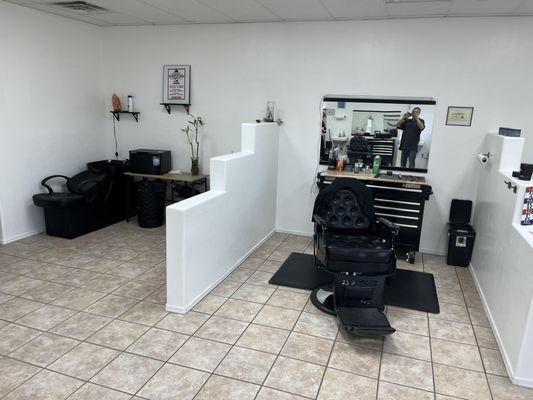 Just some shots of the barber chairs, laid-back massage chair for getting your hair washed and some signage