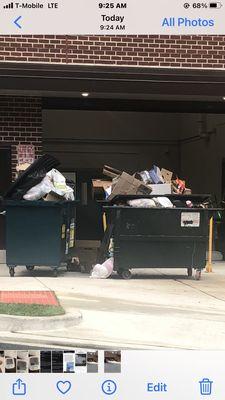 Accumulation of trash left over from the last trash dump. All containers of trash are never dumped in the same day causing a huge pile up.