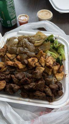 Chicken and steak hibachi with onions broccoli and zucchini with steamed rice