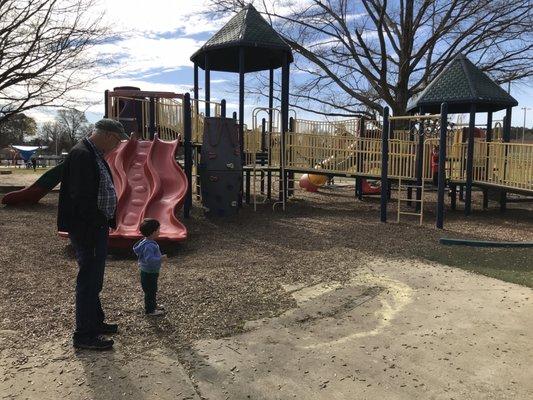 The bigger playground. There's a smaller one right next to it and 4 swings (2 for babies) in the background.