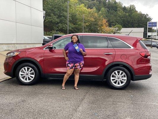 2019 Kia Sorento. Hard work pays off for this customer. She is in love with plenty of room for her growing boys.