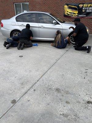 Mr. Clean Car wash employees applying more tape to my vehicle