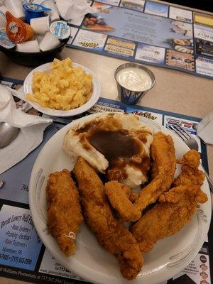 Chicken fingers with homemade mashed potatoes and Mac and cheese.