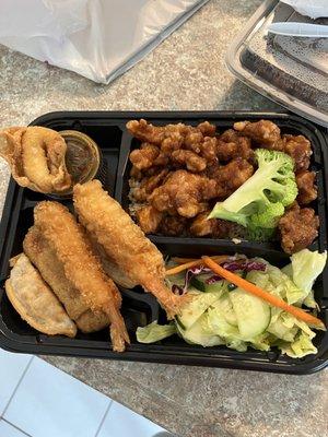 Shrimp tempura and orange chicken bento box