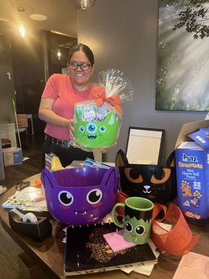 Our office manager, Clare, showing off the awesome gift basket she put together.