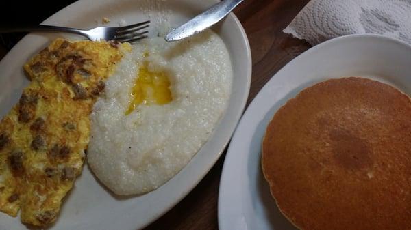 Sausage cheese omelete with grits and pancakes 5.99