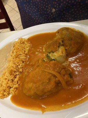 Chile relleno with cheese drooling out.