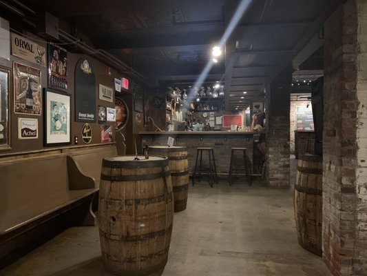 Barrel tables and stools at the bar.