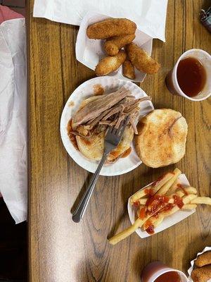 Sliced pork, hushpuppies and fries with bbq sauce. Unlike anything I have ever experienced. I would not recommend.