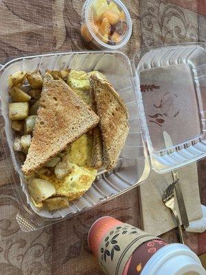 Veggie omelet with home fries and wheat bread