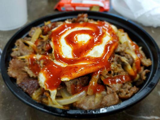 Steak, cheese, rice, egg and spicy sauce