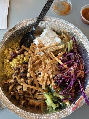 Chicken shawarma plate w/ couscous, quinoa & chickpea salad, red cabbage, cucumber & tomato salad, pita chips, and tzatziki.