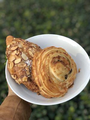 Almond croissant and raisin croissant (it's served in a brown paper bag)