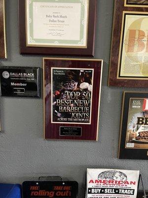 Plaques showing their accolades.