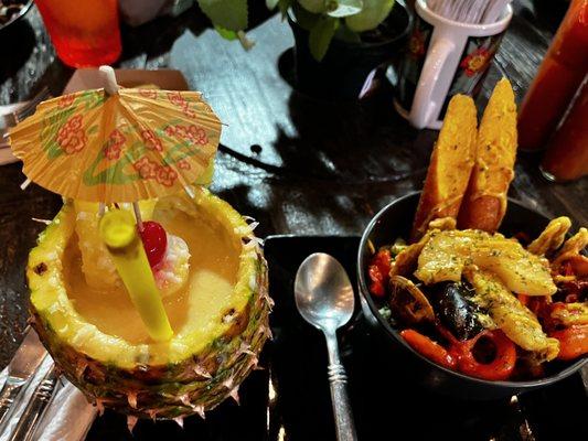 Pina colada and seafood pot