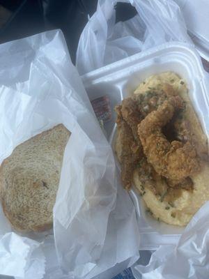 Fish and grits with toast