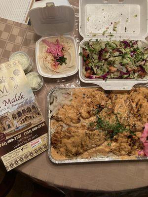 Boneless grill chicken, rice, salad, garlic sauce and hummus.