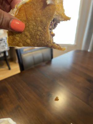 Long hair inside crispy taco.