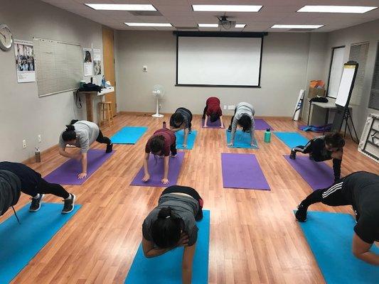 HIIT class in the conference room