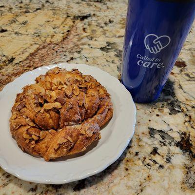 Cinnamon almond croissant and a large cup of coffee.