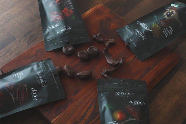 Organic pure chocolate dipped dried fruits for balance and health.