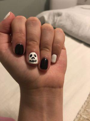 Gel manicure with Halloween nail art.