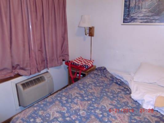 Inadequate air conditioning, dirty bedspread and walls.