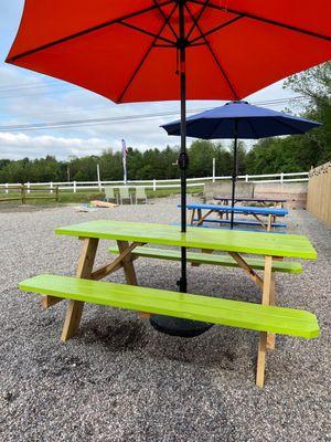 Picnic tables and corn hole