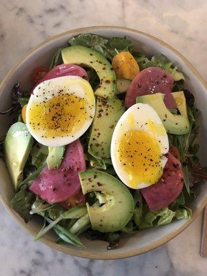 Gem salad with an egg