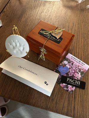 Beautiful paw print, urn, extra tags,and flower seeds to remember our sweet boy.