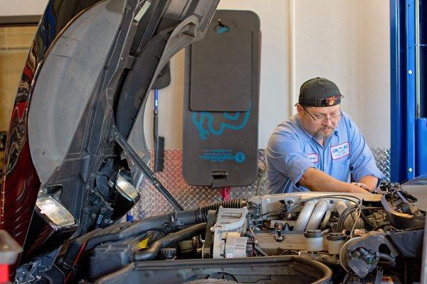 Technician Will working on a vehicle.