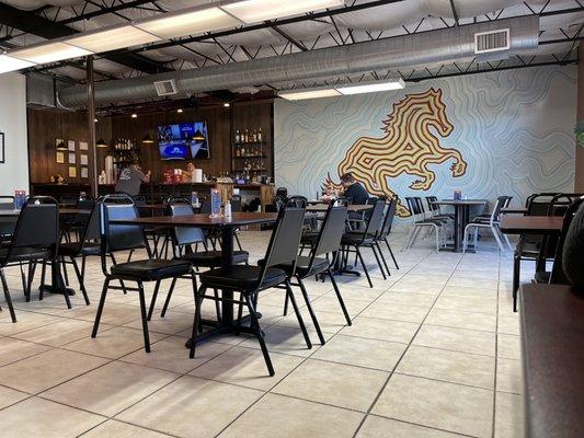 Interior of the restaurant, notice plenty of space and a bar!