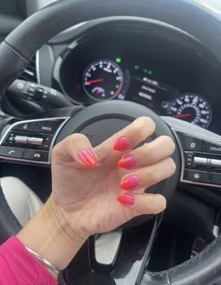 Summer nails ombré of pink into orange ish red