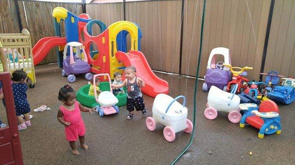 Keeping cool outside in the summer! They have a sprinkler system set up outside in their little playground.