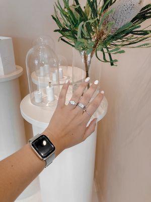 Trying on their cluster engagement ring. Also wearing stacker and boyfriend ring from Mejuri.