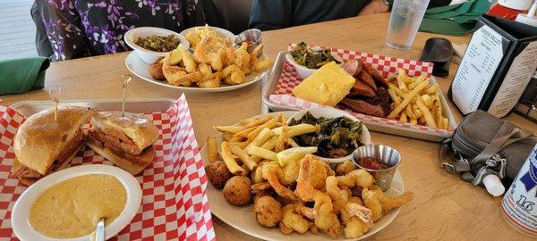 Sausage sandwich with cheesy grits, 2 Shrimp, fries and greens dinners, sausage, cornbread, mac n cheese.