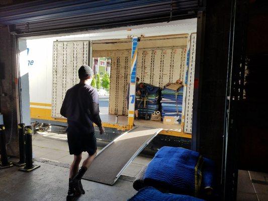 Professional mover off loading shipment into storage at our secure warehouse at 600 Orange St, Chico Ca