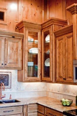 Custom Knotty Alder cabinets, Solid arched top raised panel doors with soft closing euro hinges, soft closing 22" drawer guid...