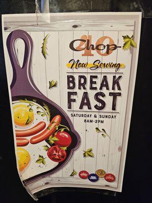 Chip 40's sign telling their customers they are serving breakfast Saturday and Sunday 8 AM to 2 PM